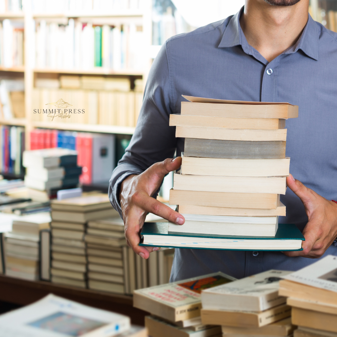Book sale A photo of an author showing the copies of his books for sale