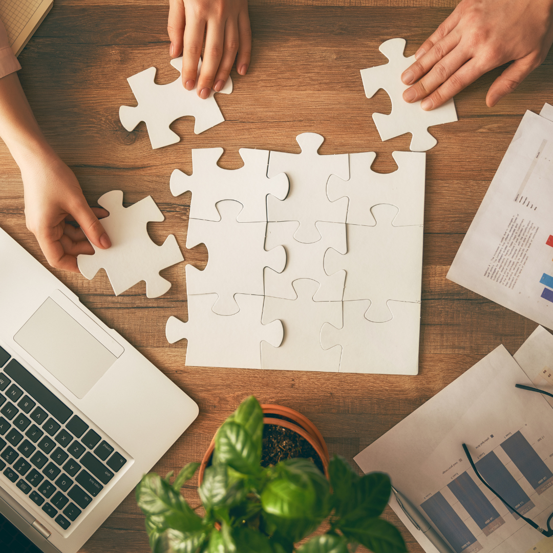 Business book surrounded by marketing tools and strategy icons.