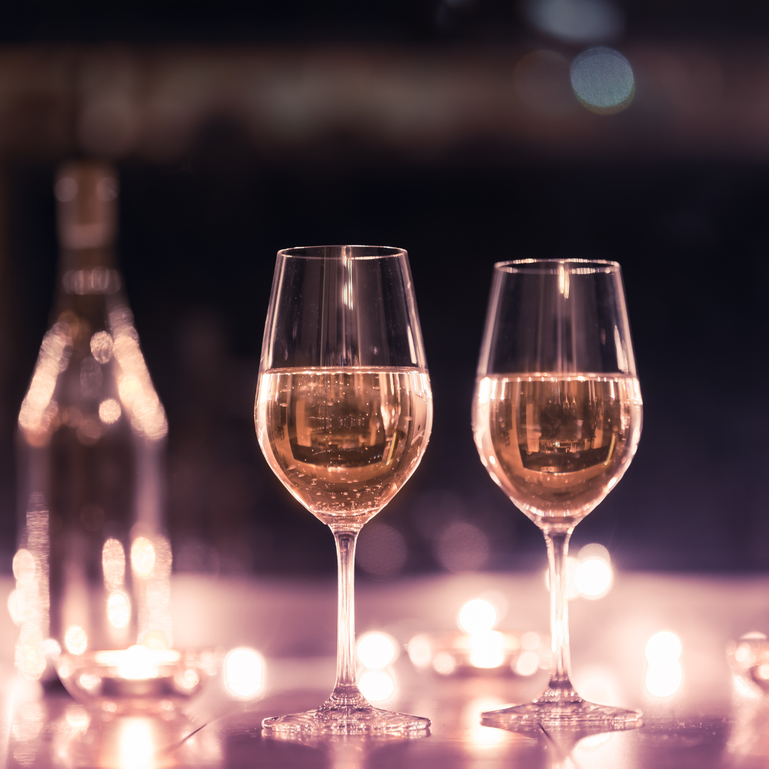 Photo of two wine glasses on a date night to symbolize my story about one blind date