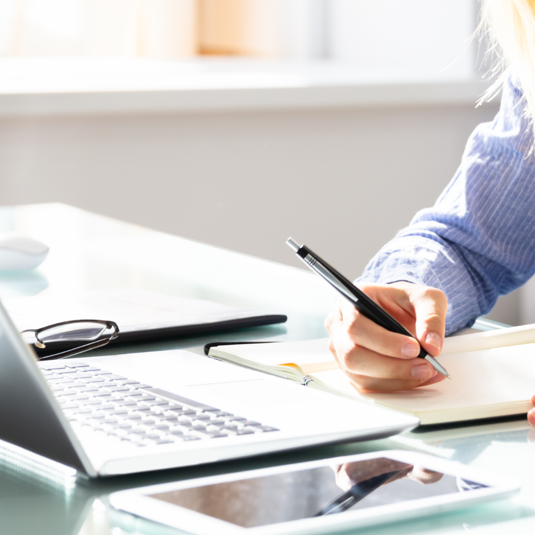 A photo of a desk of a writer while writing a book