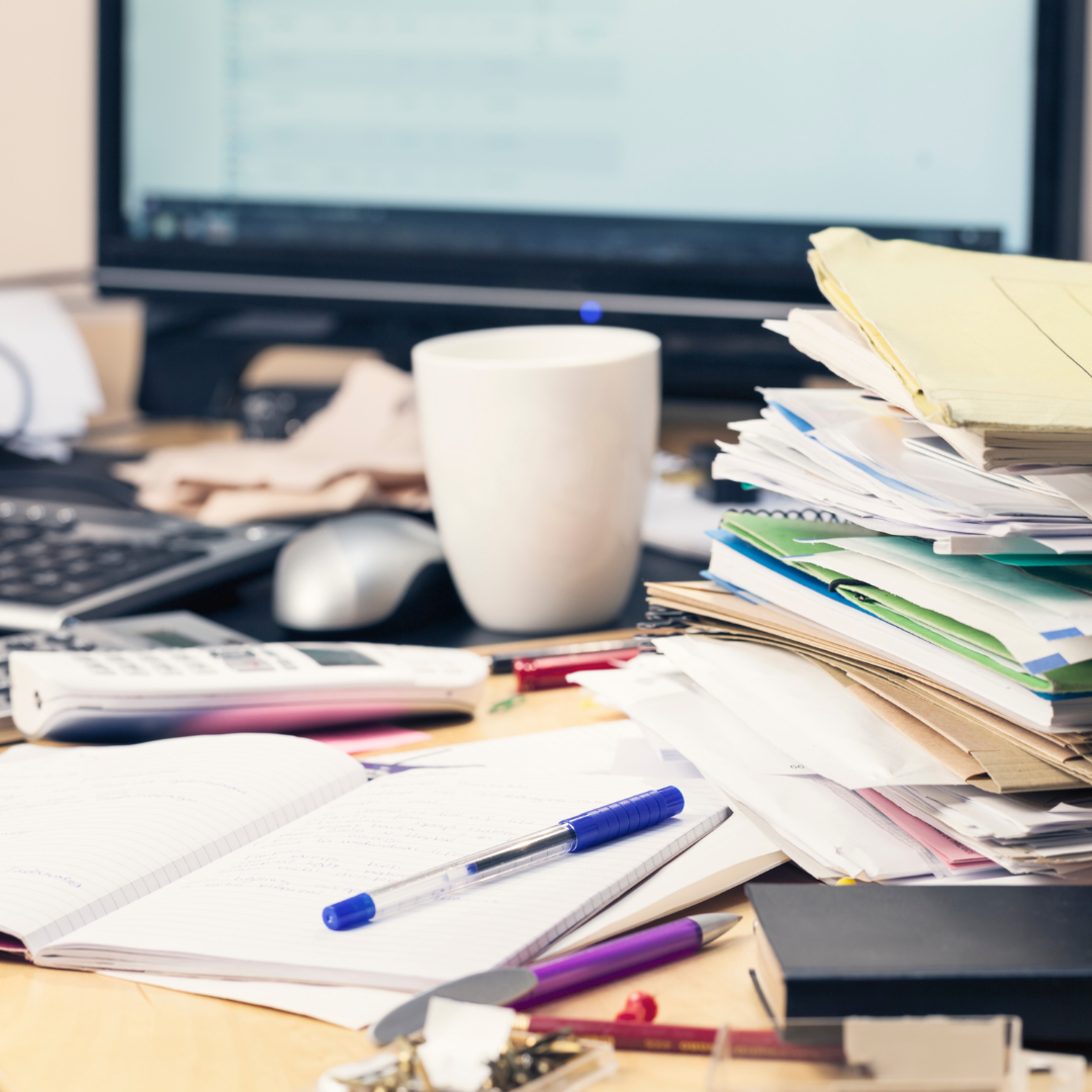 Excuse #1: I don’t have time to write a book A photo of a messy desk that shows an author's busy schedule