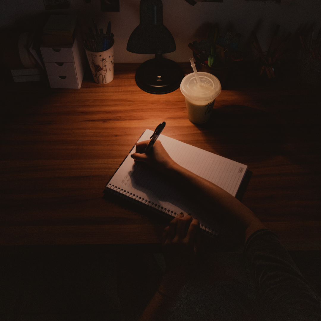 The Real Reason You Can’t Finish Your Non-fiction Book Photo of a person writing a book